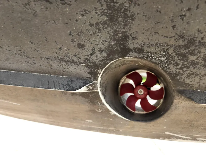 Slide: The Image of Close-up of a 2008 Intrepid 323 Cuddy boat's bow thruster. - 12