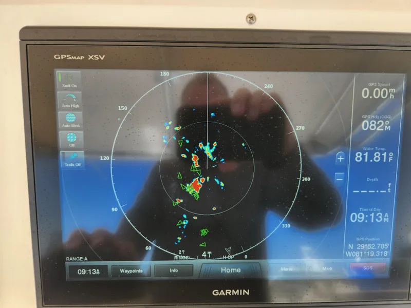 Slide: The Image of Garmin GPSMAP XSV display on 2008 Intrepid 323 Cuddy, showing radar and navigation data. - 29