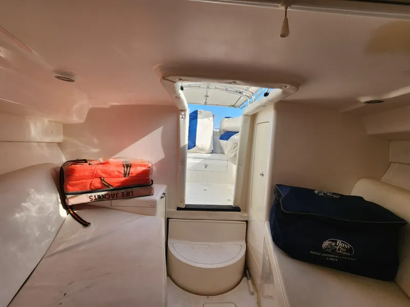 Slide: The Image of Interior of 2008 Intrepid 323 Cuddy boat with life jackets and storage. - 41