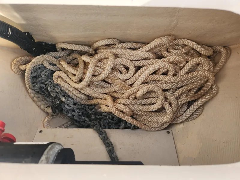 Slide: The Image of Coiled rope and chain in 2008 Intrepid 323 Cuddy storage compartment. - 43