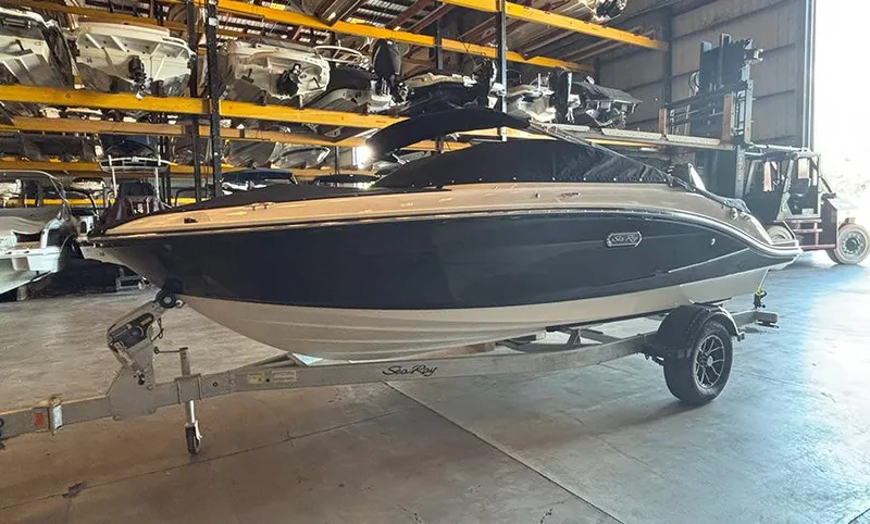 Slide: The Image of 2025 Sea Ray SPX 190 Outboard boat on trailer in storage facility. - 13