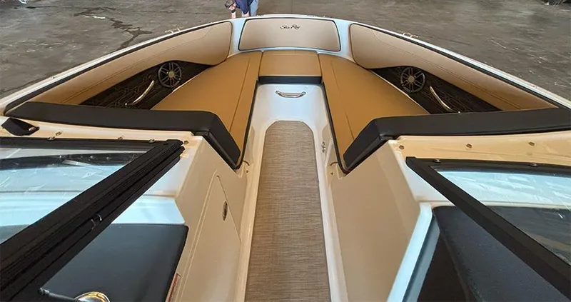 Slide: The Image of 2025 Sea Ray SPX 190 Outboard boat interior with tan seating and modern design. - 15