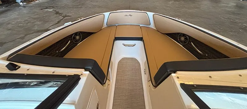 Slide: The Image of 2025 Sea Ray SPX 190 Outboard boat interior with tan seating and sleek design. - 2