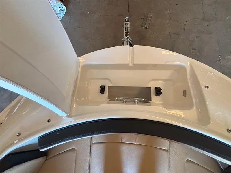 Slide: The Image of 2025 Sea Ray SPX 190 Outboard boat interior, featuring storage compartment and seating. - 4