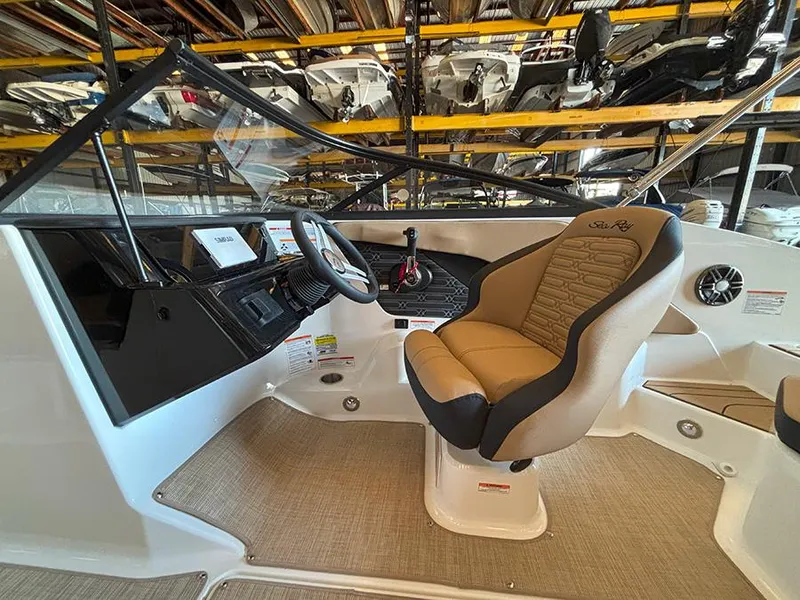 Slide: The Image of 2025 Sea Ray SPX 190 Outboard boat interior with steering wheel and captain's seat. - 6