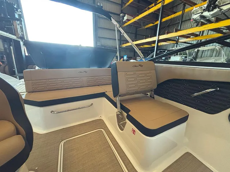 Slide: The Image of 2025 Sea Ray SPX 190 Outboard interior with tan seating and modern design. - 7