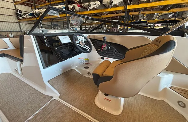 Slide: The Image of 2025 Sea Ray SPX 190 Outboard boat interior with tan seating and modern dashboard. - 8