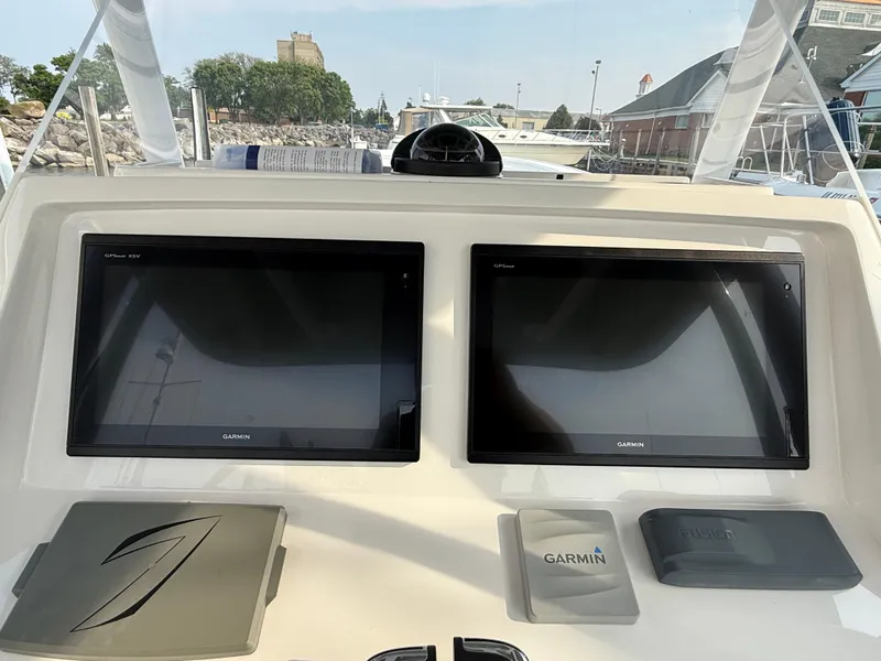 Slide: The Image of Control panel of a 2018 Intrepid 375 Open boat with dual Garmin screens. - 10
