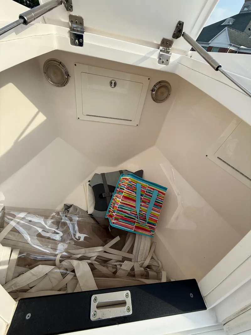 Slide: The Image of 2018 Intrepid 375 Open storage compartment with colorful bag and equipment inside. - 15