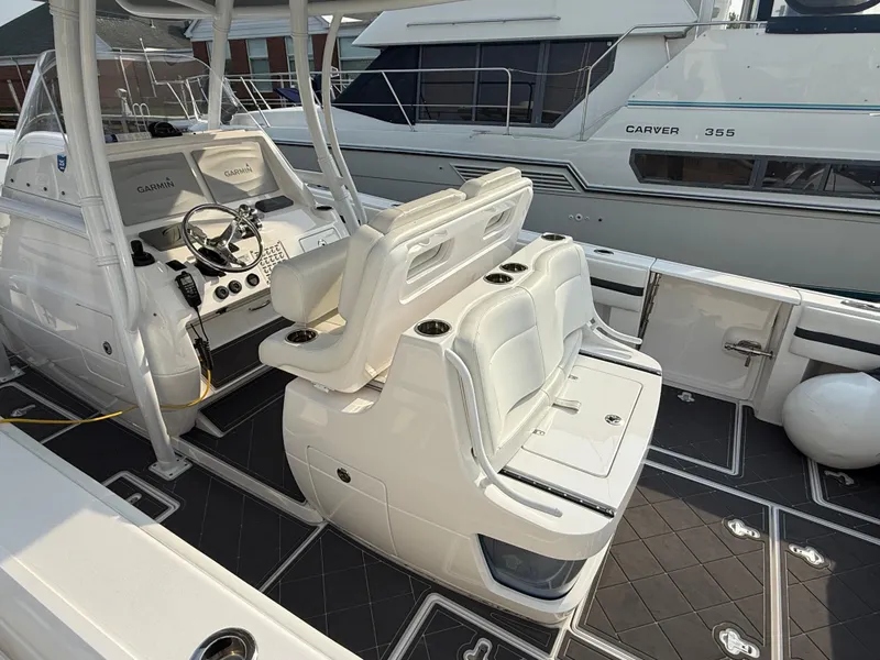 Slide: The Image of 2018 Intrepid 375 Open boat interior with helm, seating, and Garmin electronics. - 2