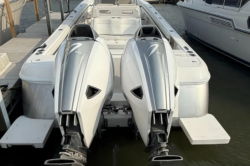 Slide: The Image of 2018 Intrepid 375 Open boat with dual outboard engines docked at marina. - 25