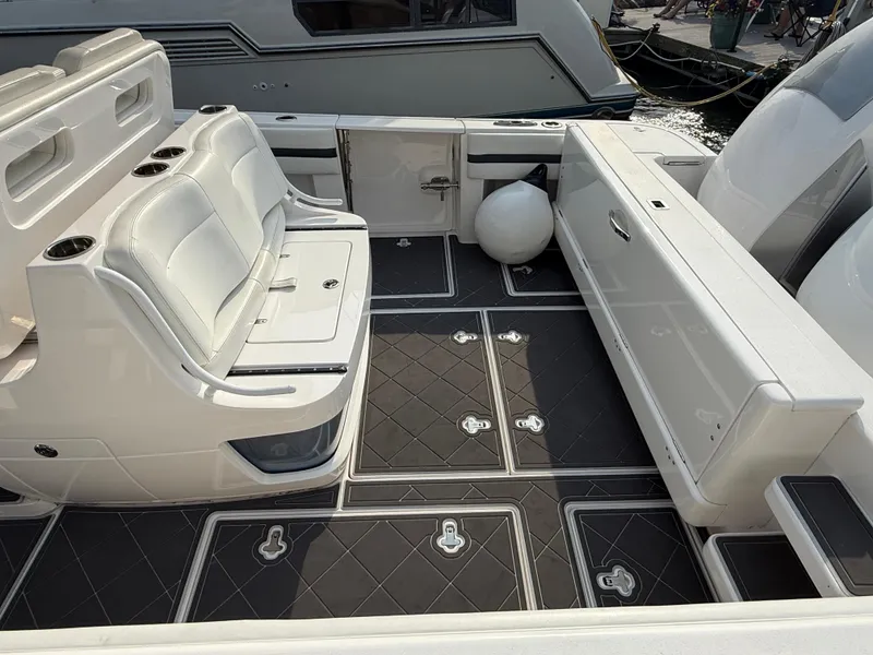 Slide: The Image of 2018 Intrepid 375 Open boat interior with cushioned seating and sleek flooring. - 3