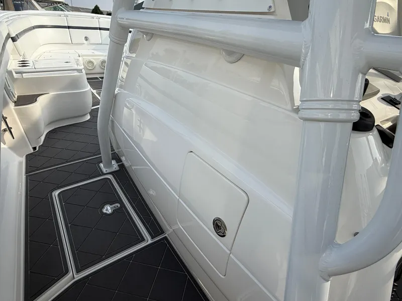 Slide: The Image of 2018 Intrepid 375 Open boat interior with sleek white design and modern features. - 9