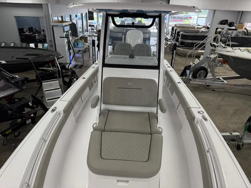 Slide: The Image of 2025 Sportsman Masters 247OE Bay Boat interior with cushioned seating and modern design. - 10