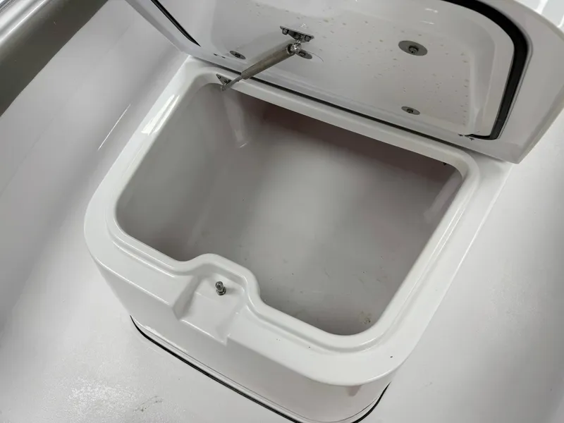 Slide: The Image of Open storage compartment on 2025 Sportsman Masters 247OE Bay Boat. - 11