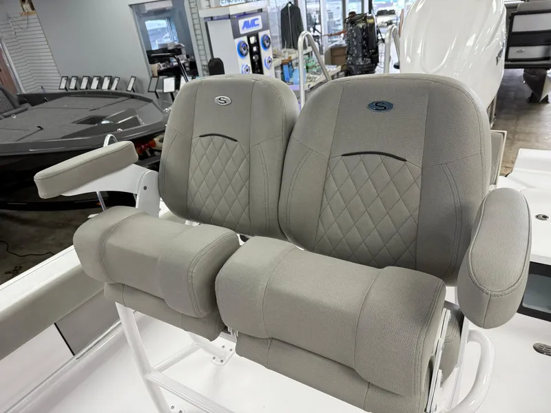 Slide: The Image of 2025 Sportsman Masters 247OE Bay Boat with comfortable, stylish seating in showroom. - 3