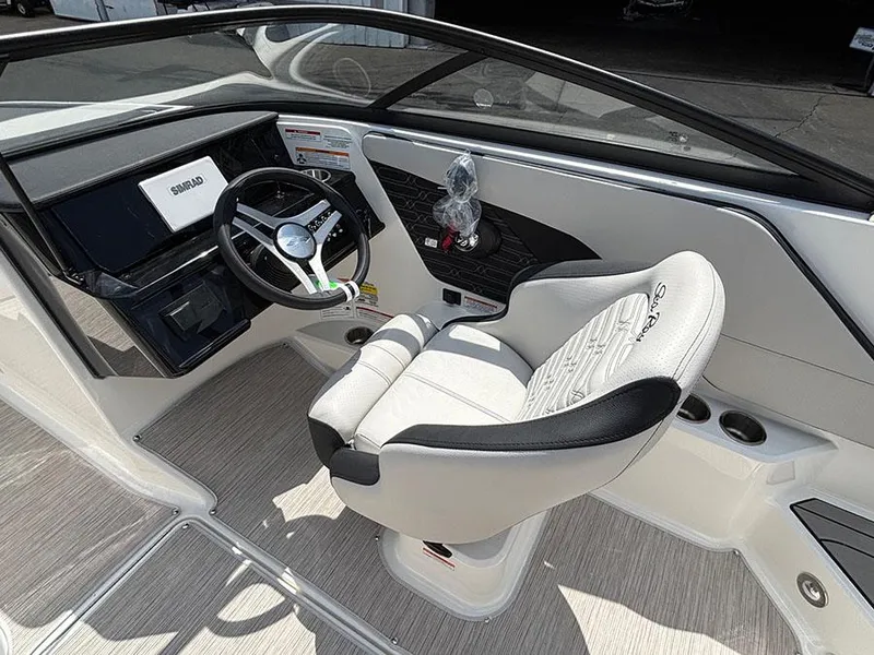 Slide: The Image of 2025 Sea Ray SPX 190 Outboard boat interior with steering wheel and captain's chair. - 10