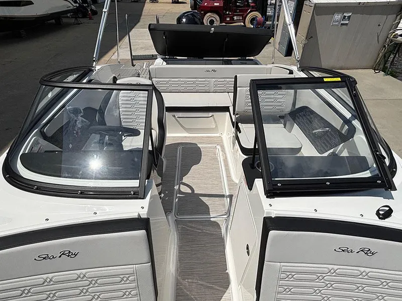 Slide: The Image of 2025 Sea Ray SPX 190 Outboard boat interior with open windshield and seating. - 14
