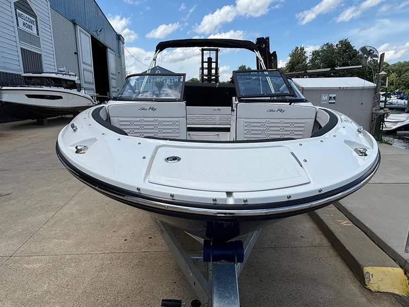 Slide: The Image of 2025 Sea Ray SPX 190 Outboard boat on trailer, dockside view. - 2