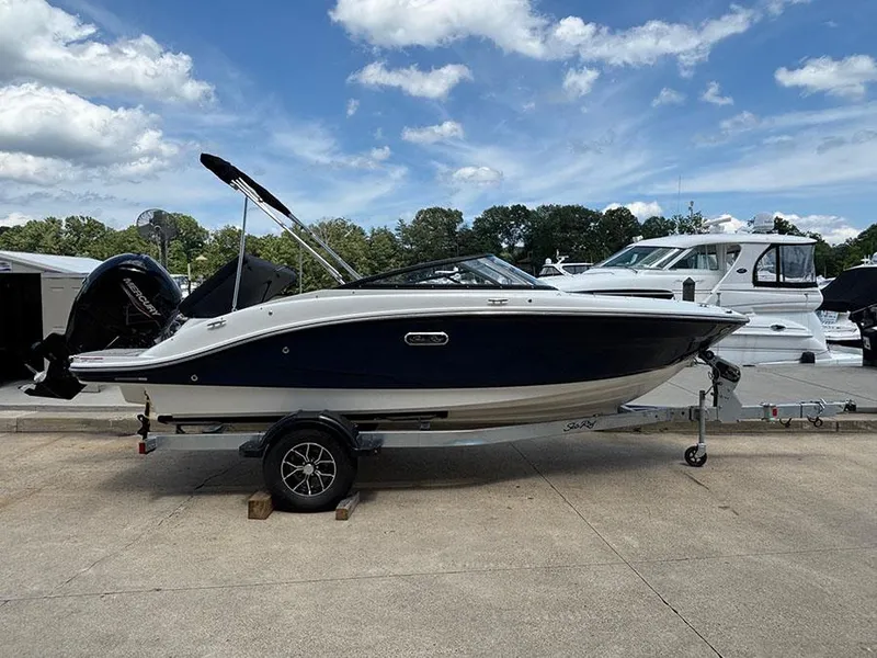 Slide: The Image of 2025 Sea Ray SPX 190 Outboard boat on trailer, parked at marina. - 3