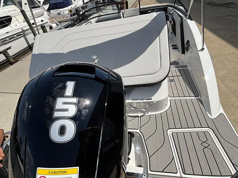 Slide: The Image of 2025 Sea Ray SPX 190 Outboard boat with 150 HP engine, docked with sleek design. - 5