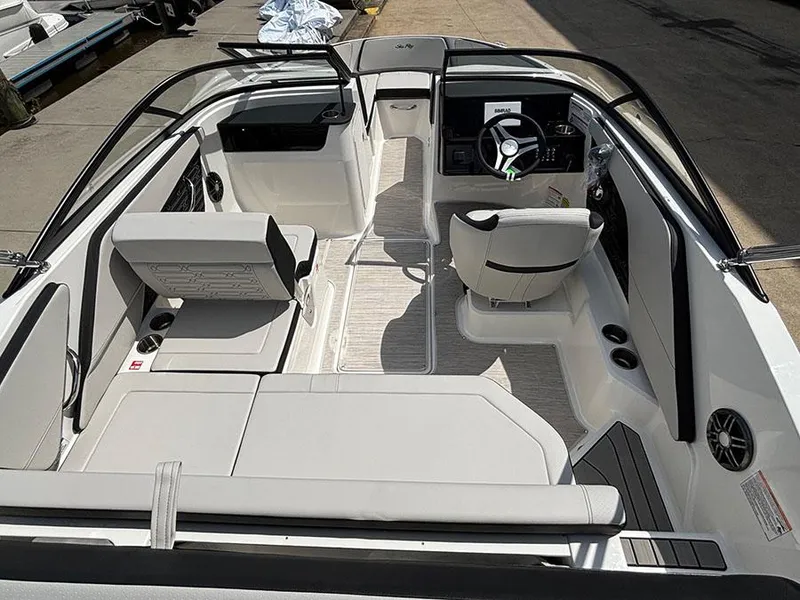 Slide: The Image of 2025 Sea Ray SPX 190 Outboard boat interior with modern seating and steering console. - 6