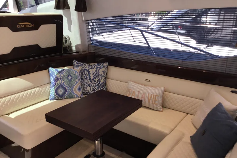 Slide: The Image of Luxurious interior of 2019 Galeon 430 HTC yacht with elegant seating and dining area. - 25