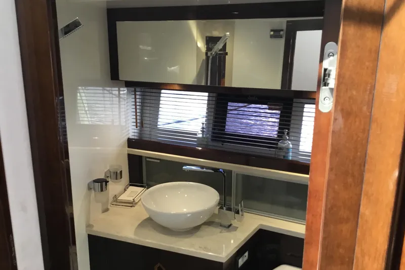 Slide: The Image of Modern kitchen sink area on 2019 Galeon 430 HTC yacht with decorative vases. - 43