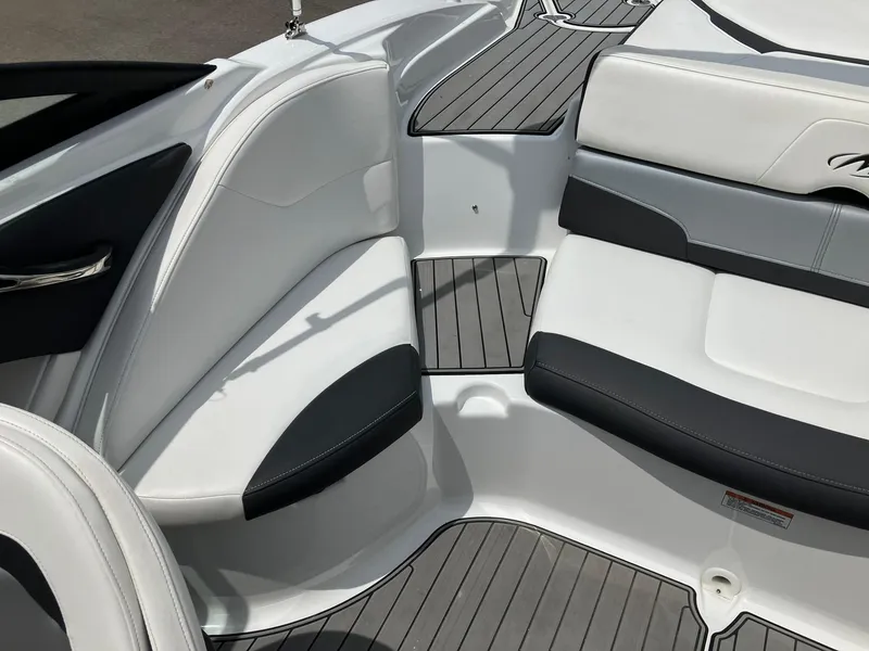 Slide: The Image of 2022 Monterey 224FS boat interior with sleek seating and modern design. - 12