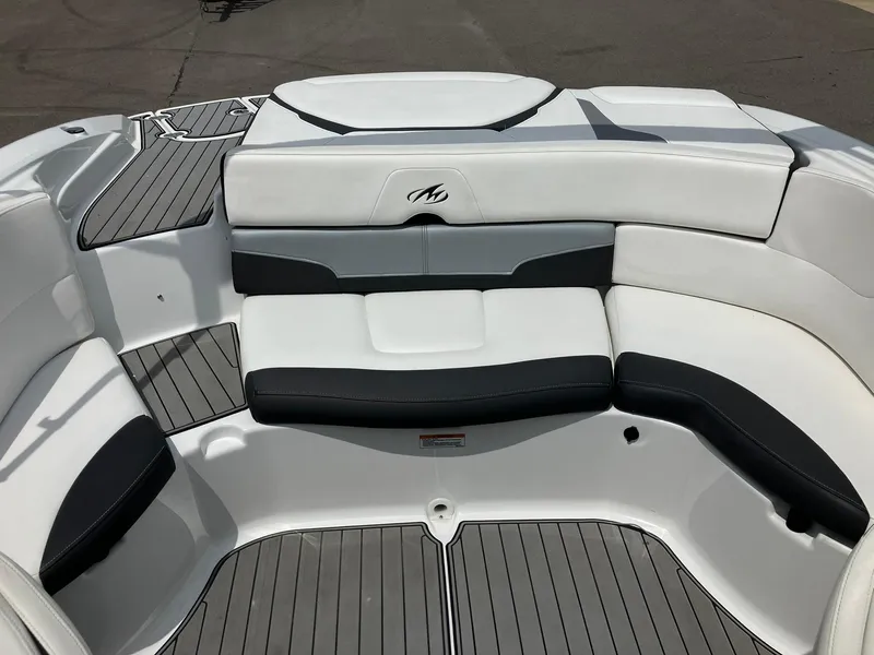 Slide: The Image of 2022 Monterey 224FS boat interior with sleek seating and modern design. - 14