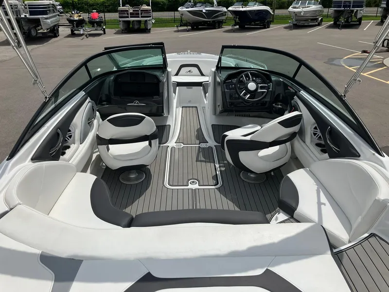 Slide: The Image of 2022 Monterey 224FS boat interior with sleek seating and modern dashboard. - 5