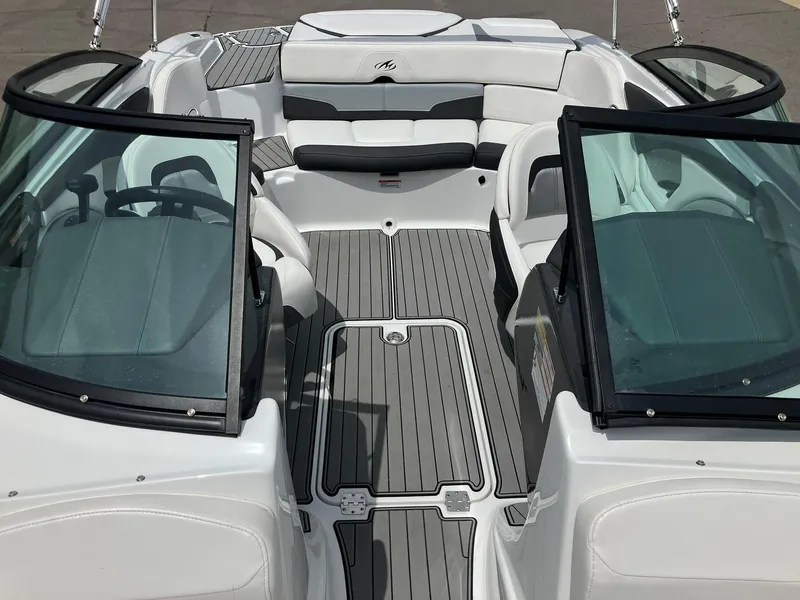 Slide: The Image of 2022 Monterey 224FS boat interior with sleek seating and modern design. - 6
