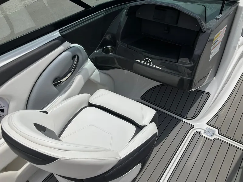 Slide: The Image of Interior of 2022 Monterey 224FS boat with white seating and sleek design. - 9