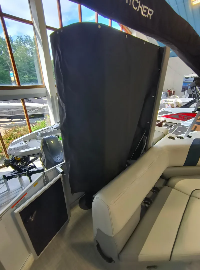 Slide: The Image of 2025 SunCatcher Select 18C boat interior with seating and covered area. - 12