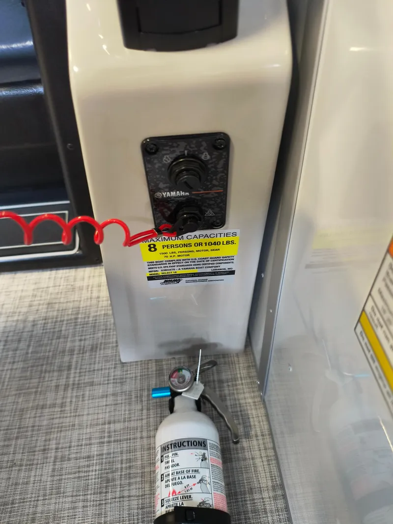 Slide: The Image of Control panel and fire extinguisher on 2025 SunCatcher Select 18C boat. - 15