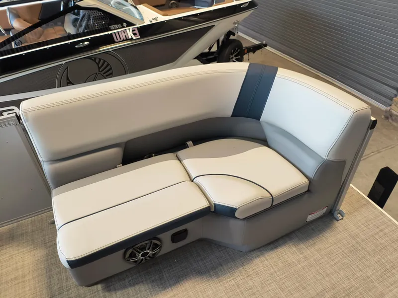 Slide: The Image of Luxury seating on 2025 SunCatcher Select 18C boat, featuring sleek design and integrated speaker. - 3