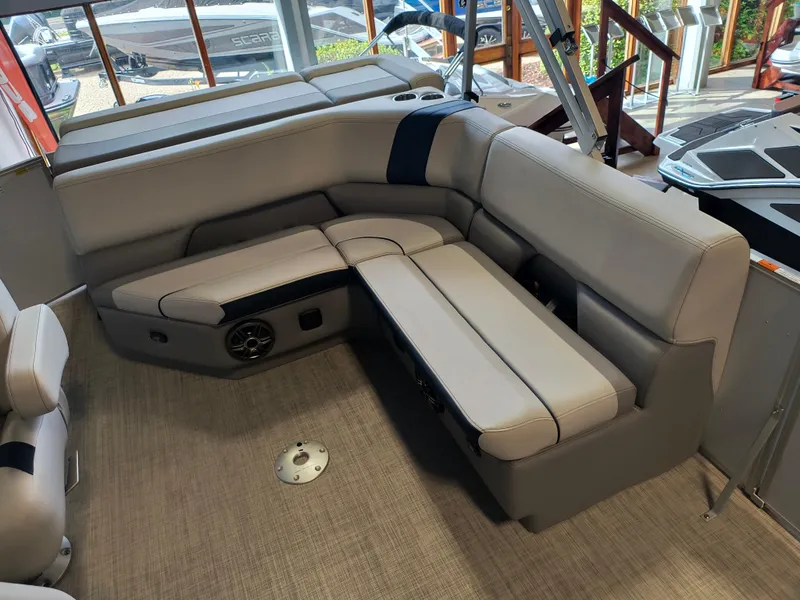 Slide: The Image of 2025 SunCatcher Select 18C boat interior with plush seating and modern design. - 5