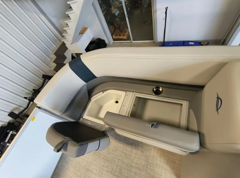 Slide: The Image of Interior view of 2025 SunCatcher Select 18C boat with seating and storage. - 9