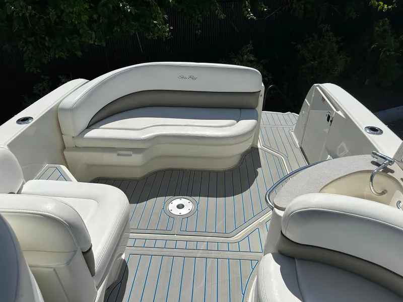 Slide: The Image of 2006 Sea Ray 260DA boat interior with white seating and sleek design. - 4