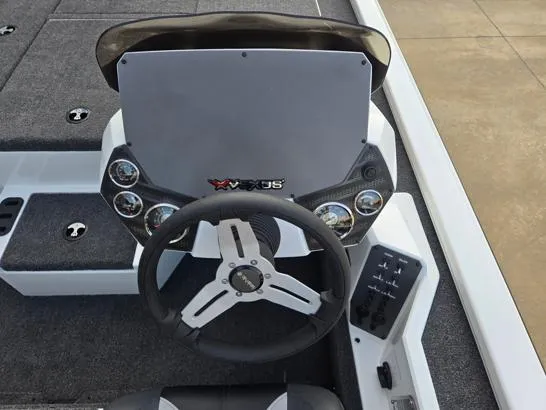 Slide: The Image of 2026 Vexus 1880C boat dashboard with steering wheel and control panel. - 4