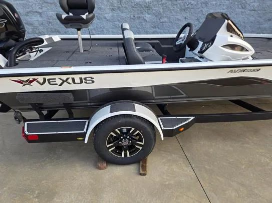 Slide: The Image of 2026 Vexus 1880C boat on trailer, side view, black and white design. - 6