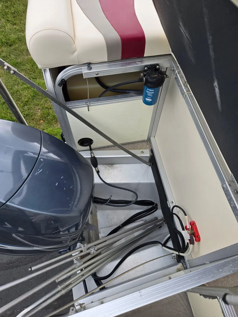 Slide: The Image of 2007 Bennington 2075GL boat engine compartment with seating and mechanical components. - 16