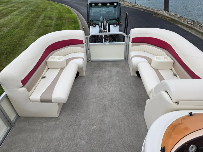 Slide: The Image of 2007 Bennington 2075GL pontoon boat interior with plush seating and cup holders. - 22