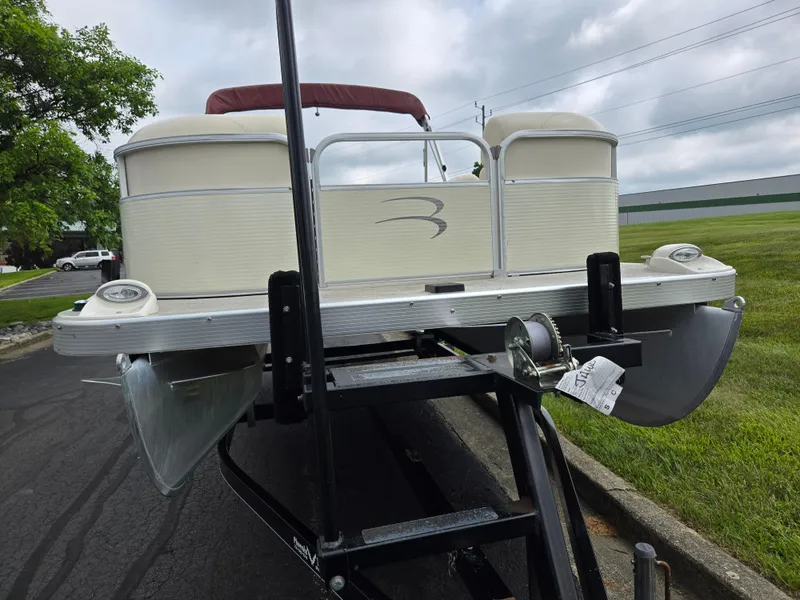 Slide: The Image of 2007 Bennington 2075GL pontoon boat on trailer, parked on asphalt near grass. - 6