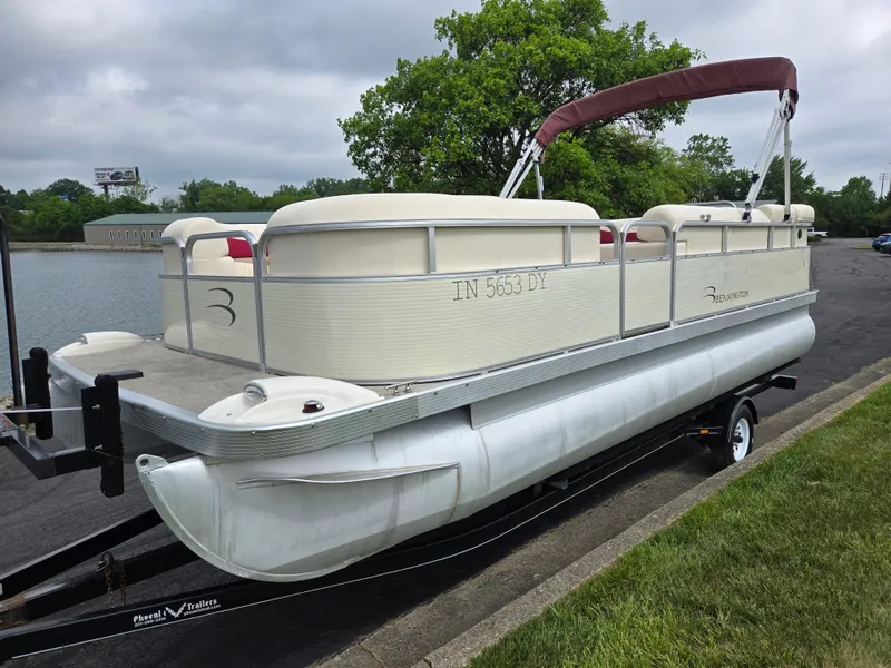 Slide: The Image of 2007 Bennington 2075GL pontoon boat on trailer by a lake, overcast sky. - 8