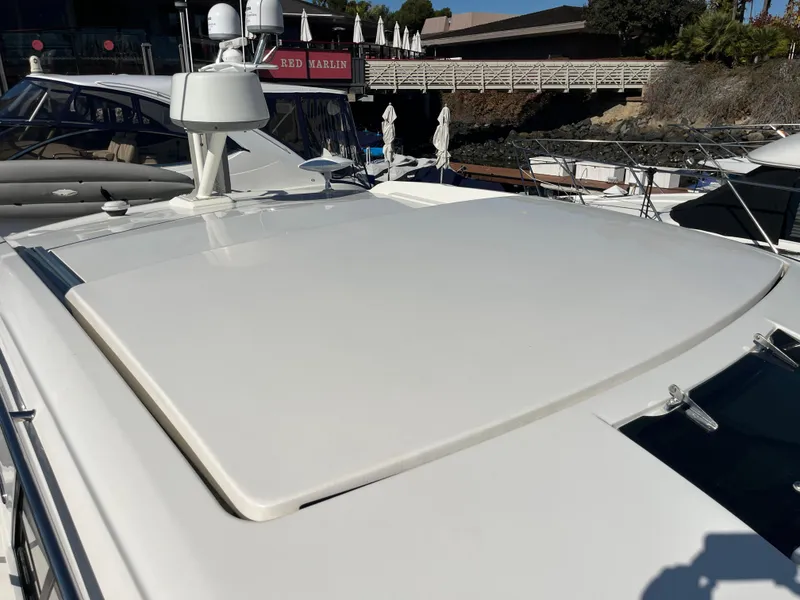 Slide: The Image of 2018 Sea Ray Sundancer 350 yacht rooftop with radar, docked at marina. - 17