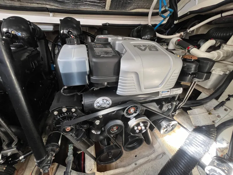 Slide: The Image of Engine compartment of a 2018 Sea Ray Sundancer 350 boat, showcasing the V8 engine. - 30