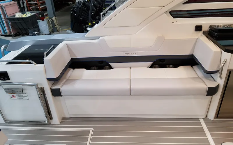 Slide: The Image of 2026 Formula 400 Super Sport Crossover boat interior with white seating and modern design. - 10