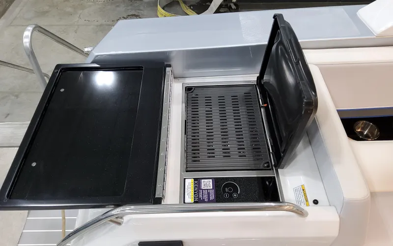 Slide: The Image of 2026 Formula 400 Super Sport Crossover boat grill station with sleek design. - 11