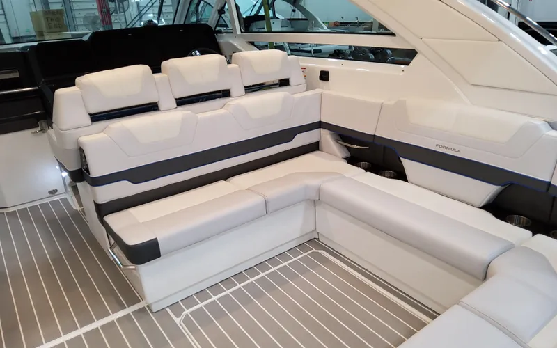 Slide: The Image of 2026 Formula 400 Super Sport Crossover interior with luxurious white seating and modern design. - 13